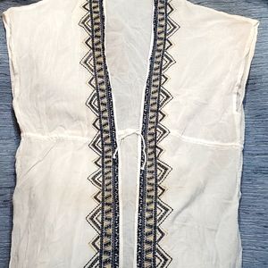 Beach swim cover up in white with navy blue & gold stitching and tie waist